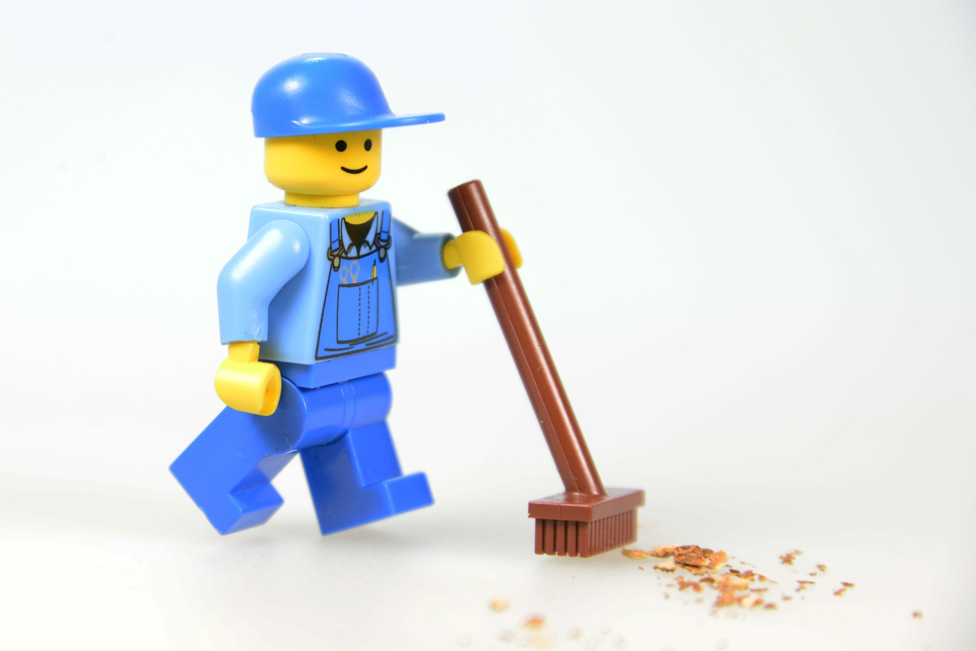 lego house cleaner sweeps up a mess